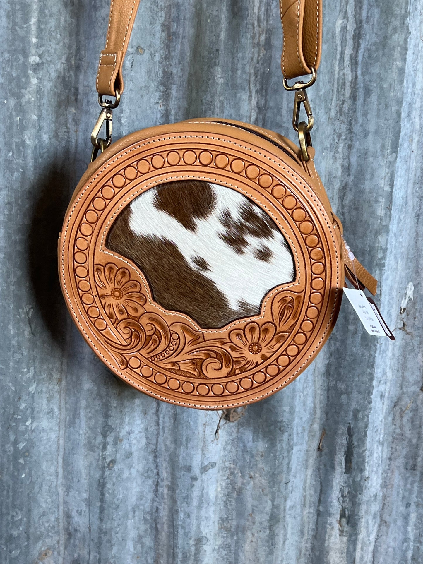 Halle round cowhide bag
