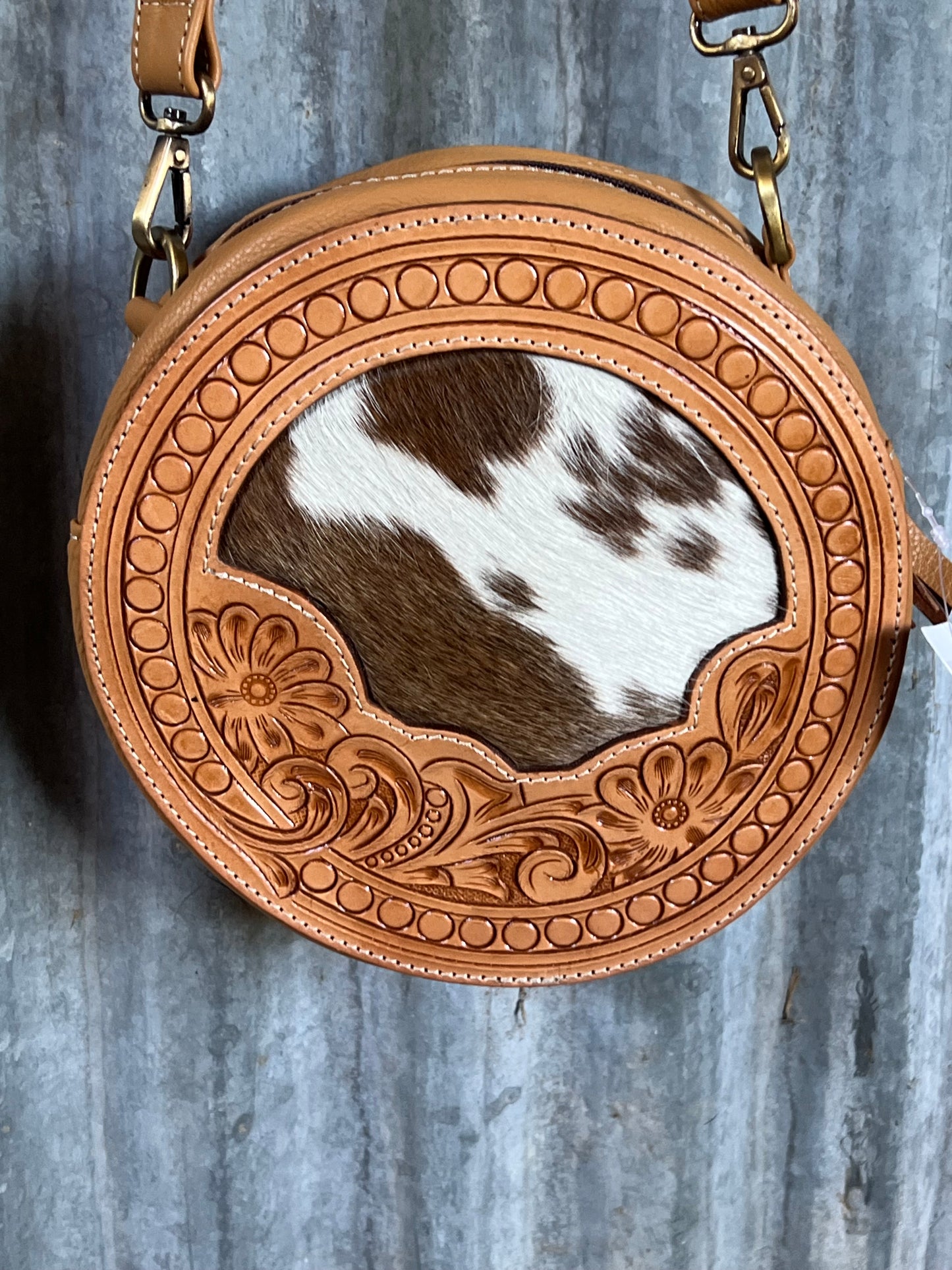 Halle round cowhide bag